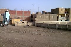 Buildings on the edge of the railway line between Al Faiyum and Al Wasta in Egypt.
