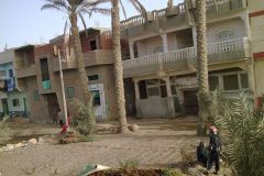 Buildings on the edge of the railway line between Al Faiyum and Al Wasta in Egypt.