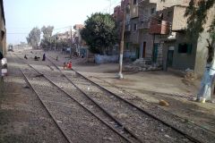 Buildings on the edge of the railway line between Al Faiyum and Al Wasta in Egypt.