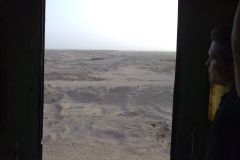 Desert landscape at the edge of the railway line between Al Faiyum and Al Wasta in Egypt.