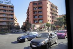 Urban Street Intersection Near Hotel Agdal in Marrakesh with Traffic and Modern Apartment Buildings
