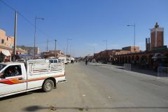 Wide Avenue Near the Medina of Essaouira with Light Traffic, Market Activity, and Clear Blue Sky