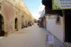 Quiet Medina Alley in Essaouira with Small Shops, Pedestrians, and Historic Stone Architecture