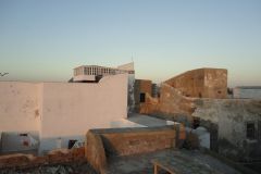 Rooftops and Historic Stone Buildings in Essaouira Medina Seen in Soft Evening Light