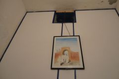 Simple Interior Wall with Framed Artwork and Minimal Rustic Decor