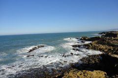 Rocky Atlantic Coastline Near Essaouira with Waves Breaking Against Jagged Shore