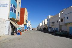 Wide Commercial Street with Colorful Buildings in Sidi Ifni