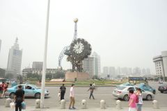 A strange clock in front of the train station in Tianjin, China