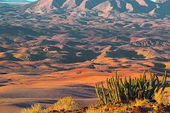 Desert landscape during sunset  at Valley of a Thousand Hills Campsite in Namibia