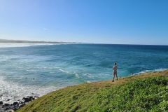 Surfers and headland views at Cabarita Beach, New South Wales