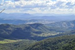Layered Mountain Ranges Under High Autumn Skies