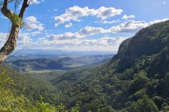 Layered Mountain Ranges Under Spring Skies