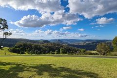 Elevated Pasture Overlooking Layered Mountain Ranges