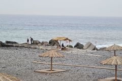 Straw Parasols by the Shoreline, Ponta do Sol, Madeira