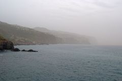 Misty Atlantic Cliffs Fading into the Horizon near Ponta do Sol, Madeira