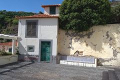 Traditional Madeira House with Green Door and Azulejo Bench