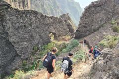 Hikers descending stone steps on the Pico do Arieiro–Pico Ruivo trail, Madeira