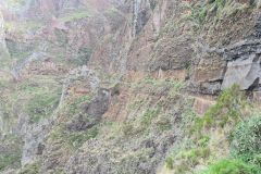 Narrow cliffside trail carved into volcanic rock, Madeira Central Mountains, Portugal