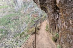 Exposed cliffside hiking path carved into rock, Madeira Central Mountains, Portugal