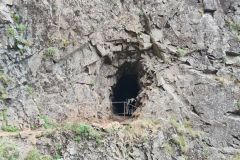 Rock tunnel on PR1 Vereda do Areeiro hiking trail near Pico do Arieiro, Madeira, Portugal