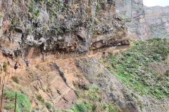 Overhanging cliff section on PR1 Vereda do Areeiro trail near Pico Ruivo, Madeira, Portugal