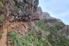 Overhanging cliff traverse on PR1 Vereda do Areeiro near Pico Ruivo, Madeira, Portugal