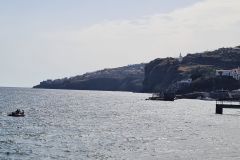 Cliffside Coastline and Small Boat off Santa Cruz, Madeira