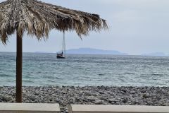 Pebble Beach with Sailboat off Praia Formosa, Madeira