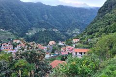 Mountain Village Spread Across a Deep Green Valley Near a Levada in Boa Ventura, Madeira