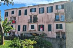 Weathered Apartment Block with Balconies