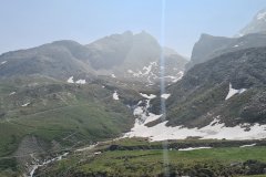 High Alpine Basin with Melting Snowfields in the Italian Alps