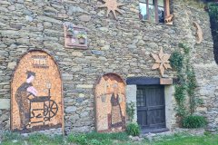 Decorated Stone House with Folk Art in a Remote Alpine Village Setting