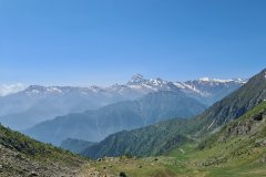 High Alpine Panorama with Snowcapped Peaks Over a Remote Mountain Valley