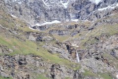 Seasonal Waterfall on Steep Rock Faces in Valnontey Valley below the Gran Paradiso Massif