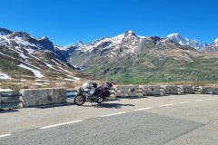 Motorcycle Overlooking Alpine Pass at Col du Petit Saint-Bernard, Aosta Valley