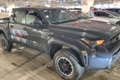 Toyota Tacoma Pickup Parked in a Multi-Level Parking Garage