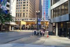 Chicago “L” Train Passing Downtown Streets with Pedestrians
