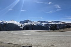 Hairpin Curve on a High Mountain Pass, Colorado — Snow-Capped Rocky Mountain Highway