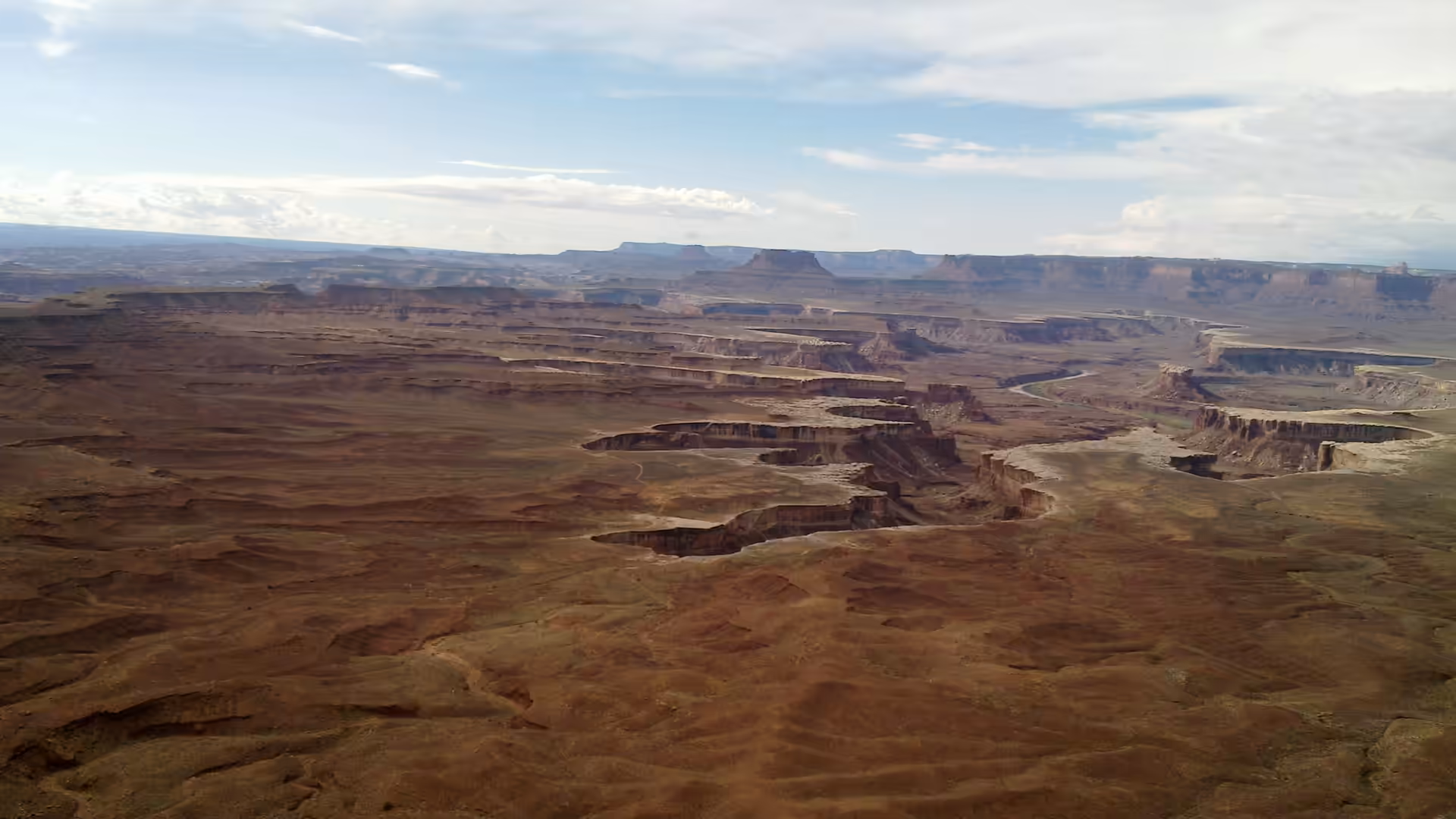 Expansive view over layered canyons and mesas from a high overlook