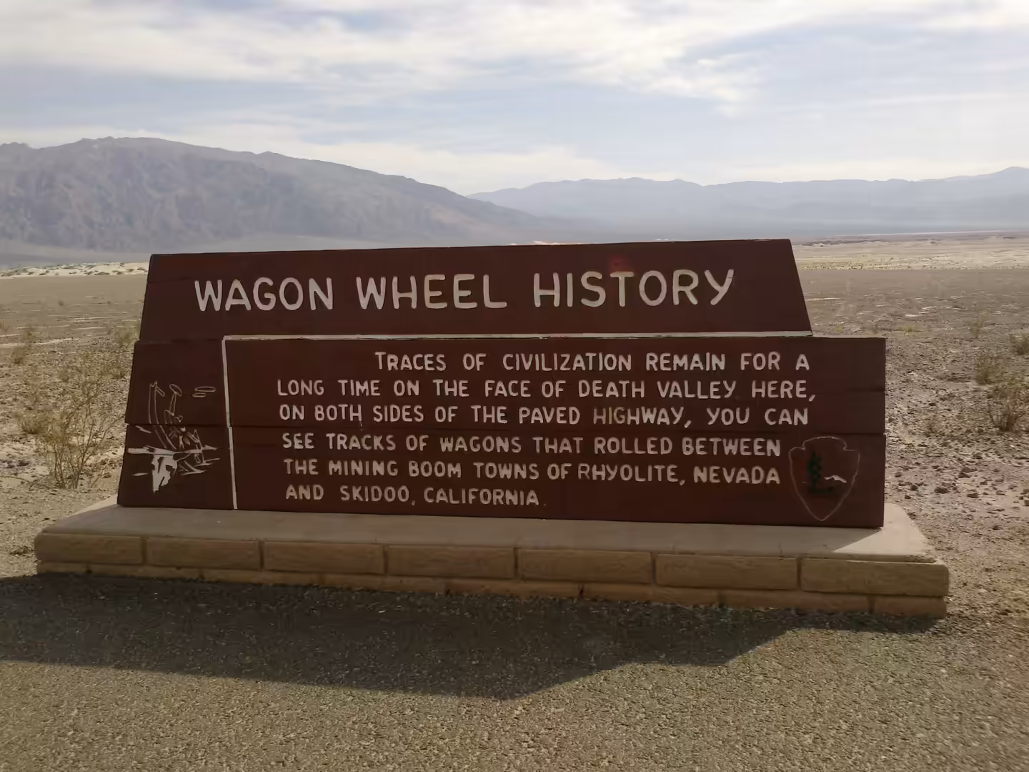 Wagon Wheel History roadside sign in Death Valley National Park describing historic wagon routes