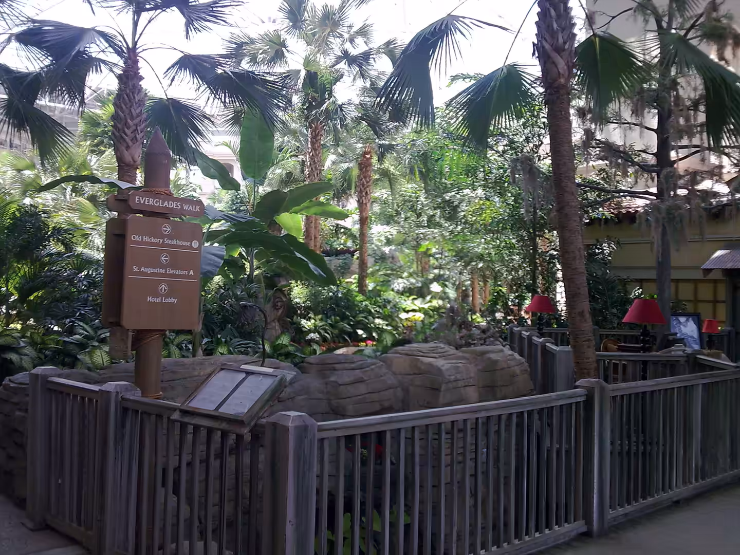 Everglades Walk sign inside Gaylord Palms near Orlando, surrounded by palm trees and lush indoor greenery.