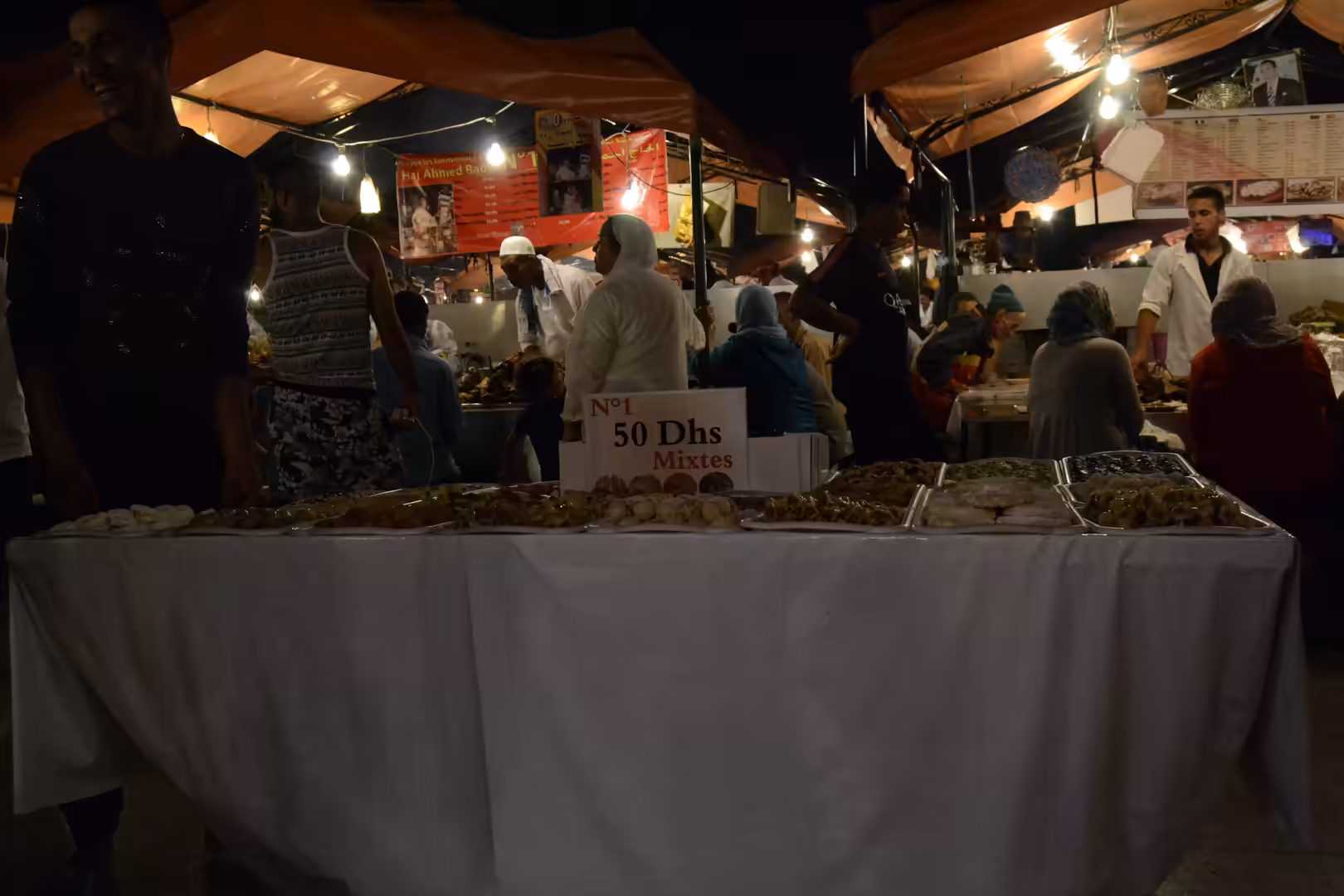 Night food stalls with crowds at Jemaa el-Fnaa