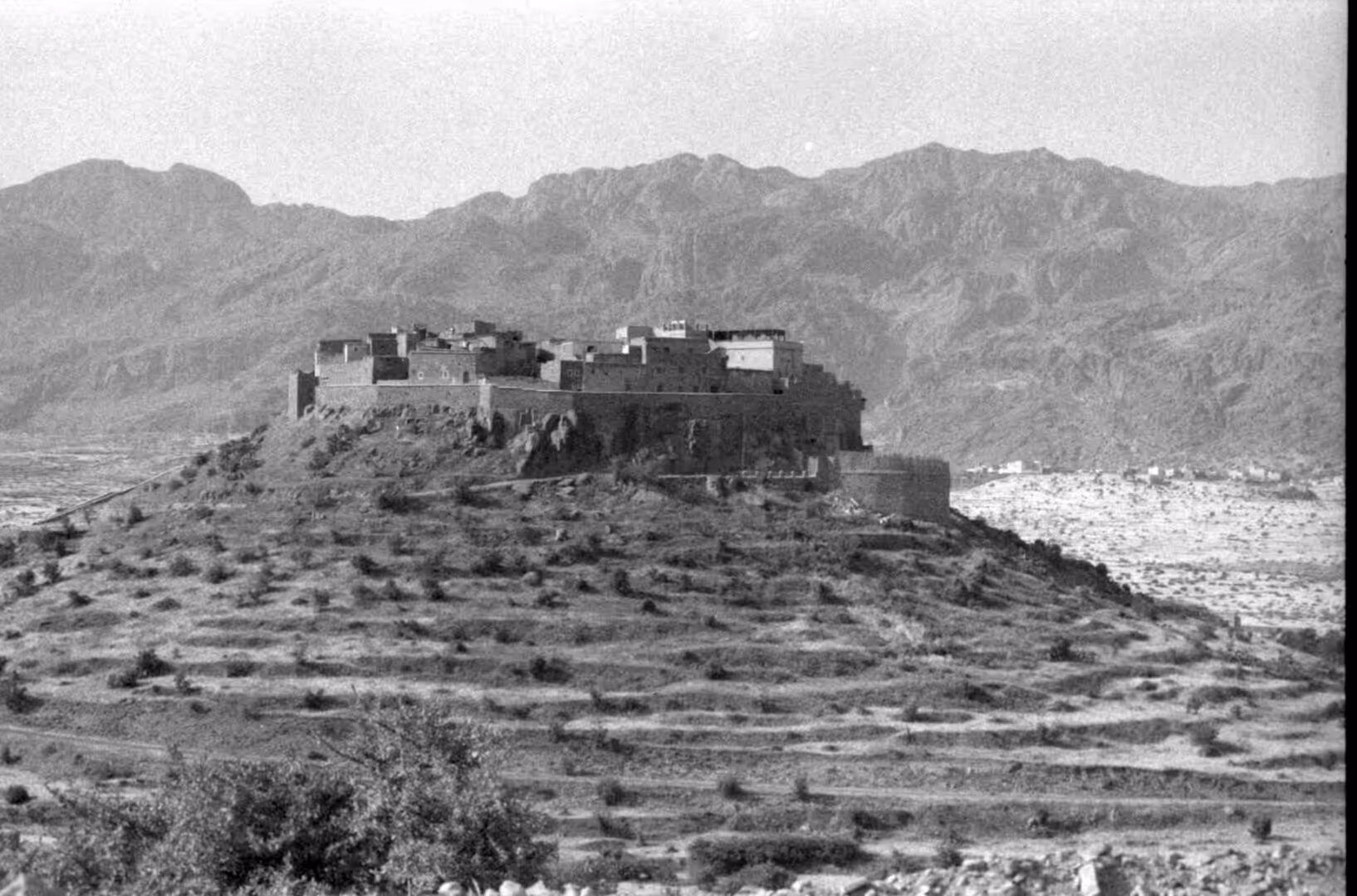 Fortified hilltop village overlooking terraced fields in southern Morocco