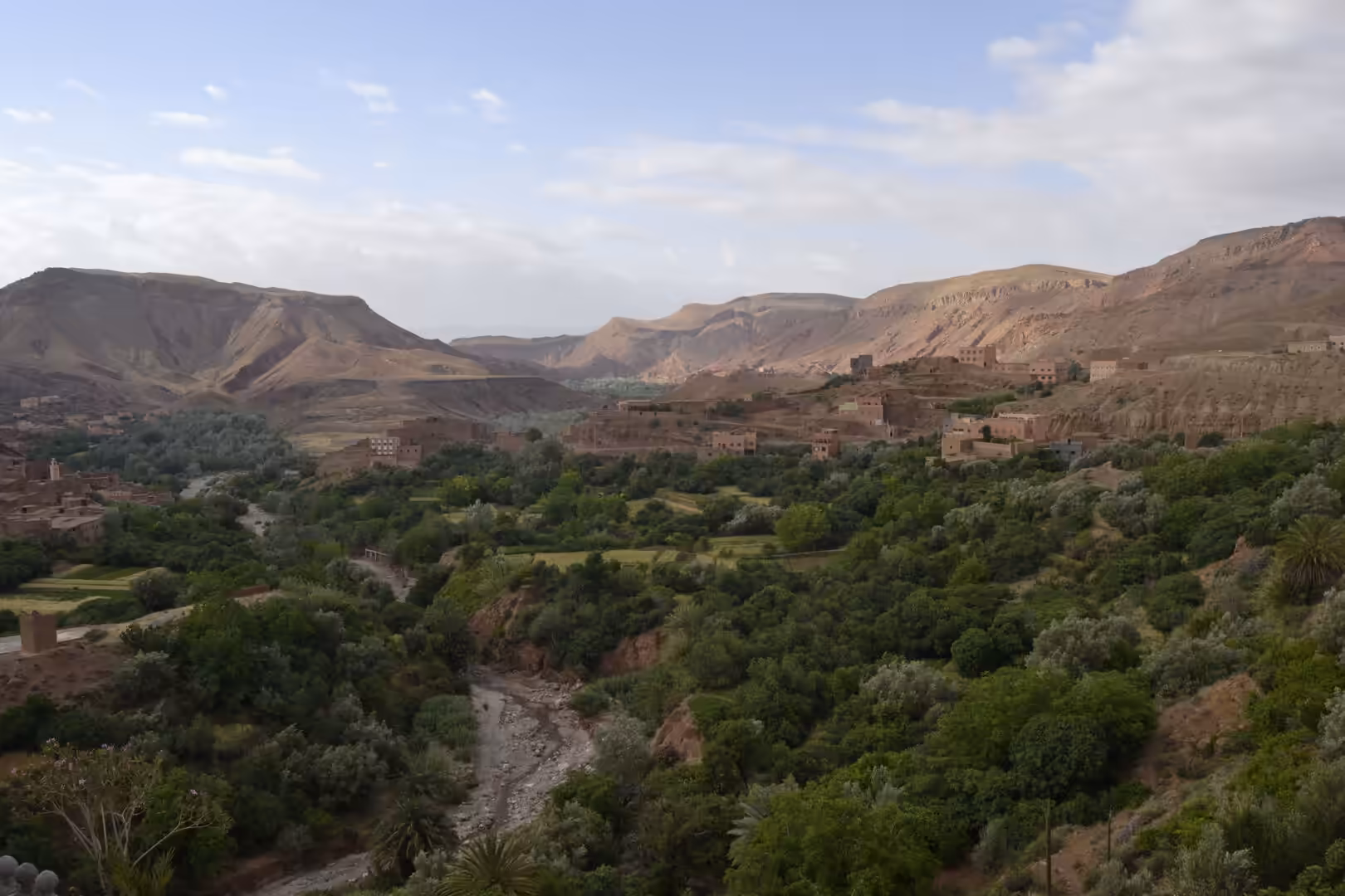 Green oasis valley surrounded by desert mountains in Morocco