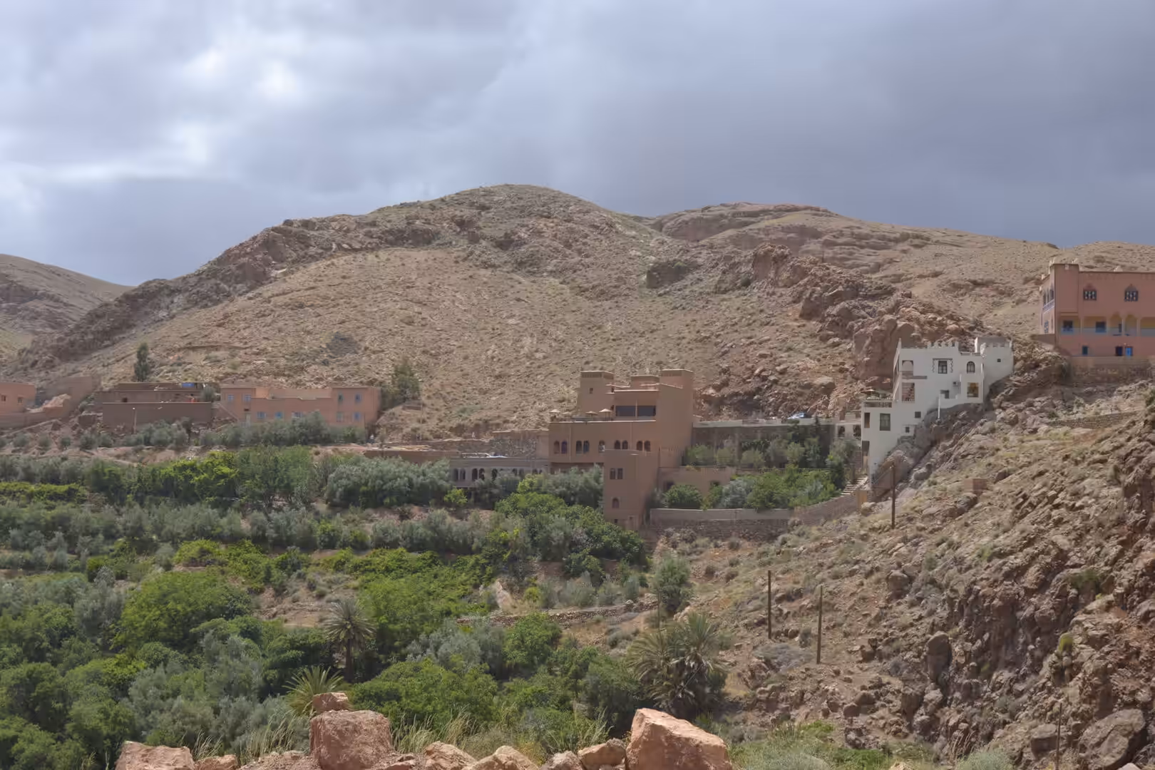 Traditional buildings overlooking a green oasis valley