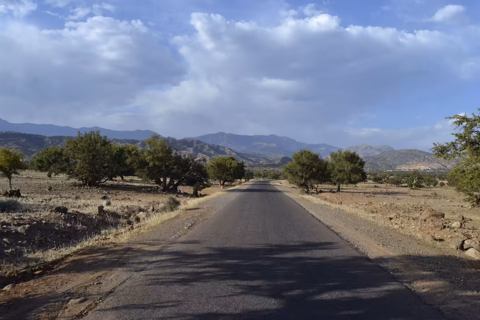 Empty rural road leading toward the Atlas Mountains
