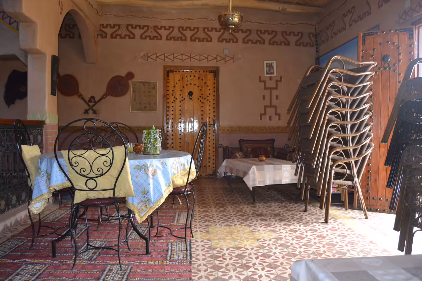 Traditional Moroccan restaurant interior with decorated walls and tables