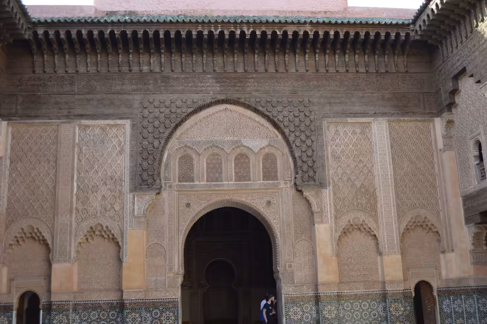 Decorative courtyard wall and arch at Ben Youssef Madrasa