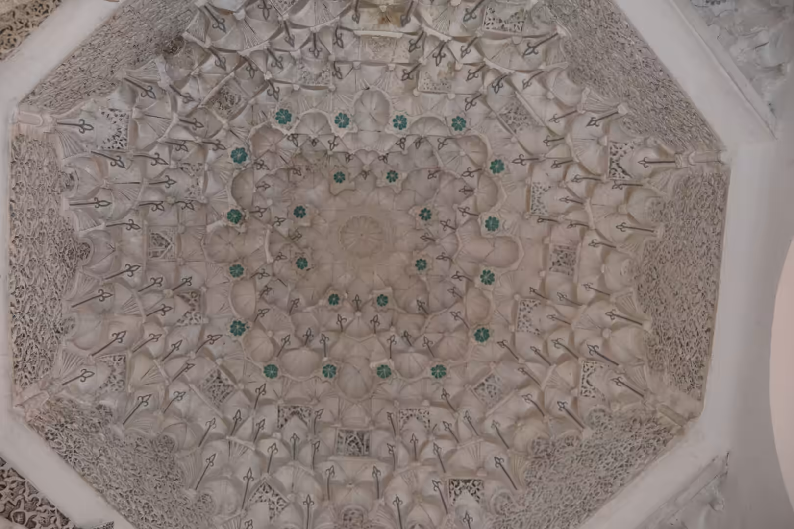 Intricate muqarnas ceiling inside Ben Youssef Madrasa