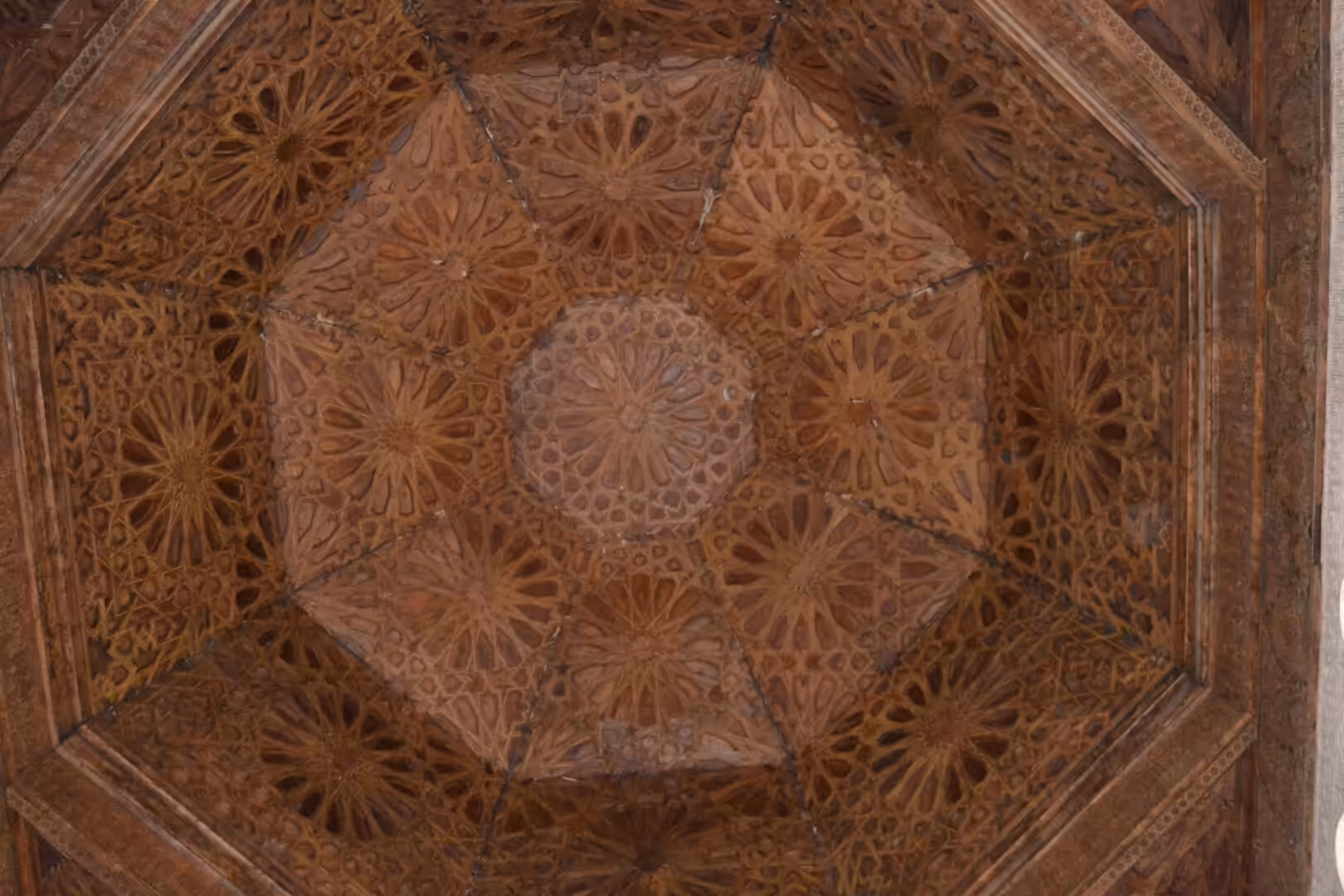 Carved geometric wooden ceiling at Ben Youssef Madrasa